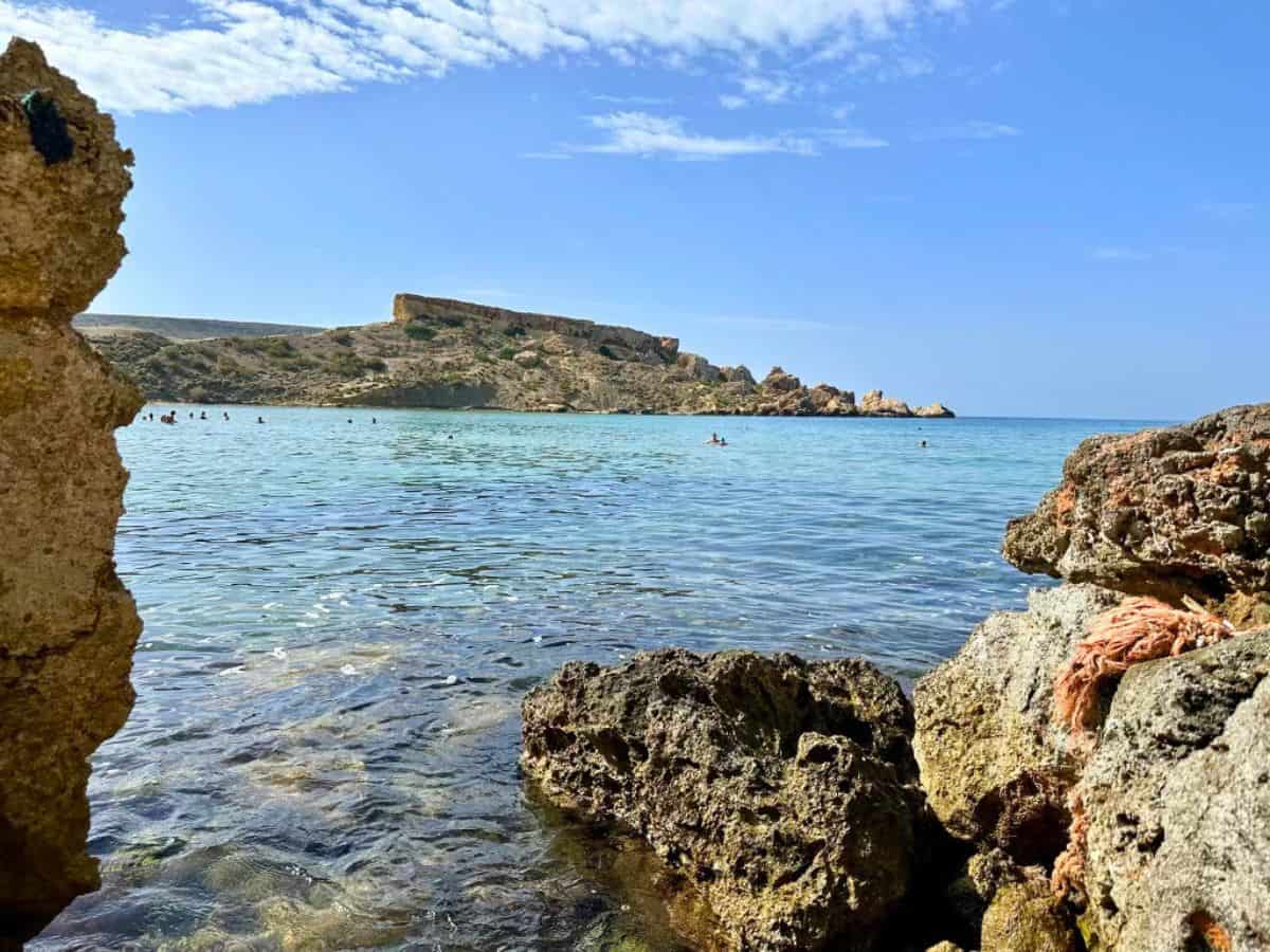 Ghajn Tuffieha Bay, one of my favorite spots for swimming in Malta with its rocky coves and sandy beaches