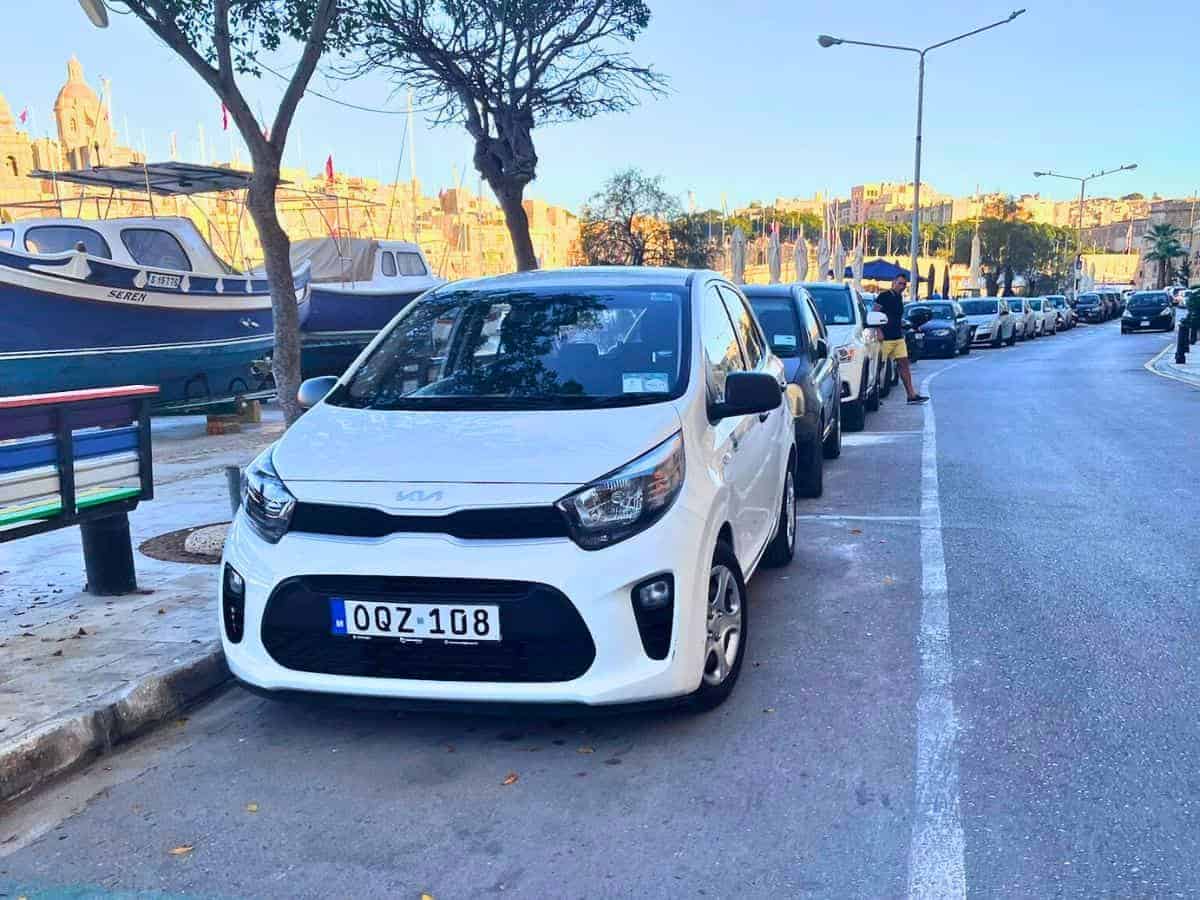 A small white rental car on Malta